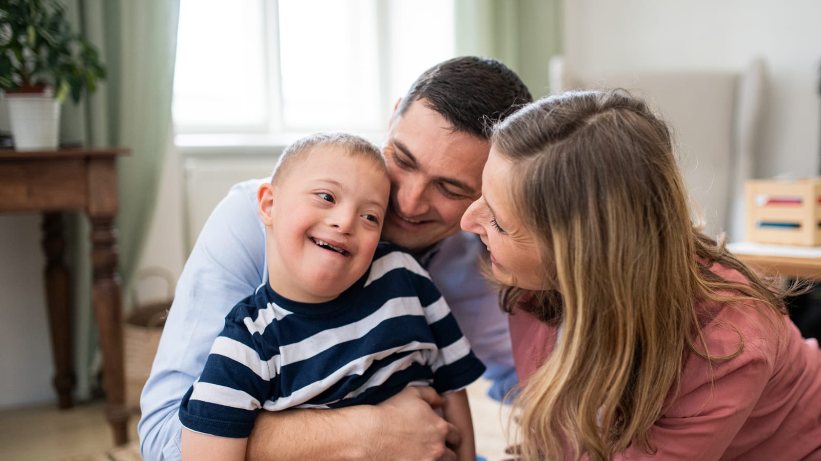 A parent and child working together on everyday living skills